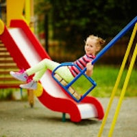 Playground Child on Swing